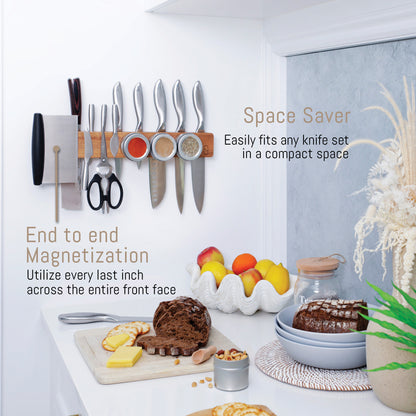 Knife holder with magnetic knife set on a kitchen counter with food items.
